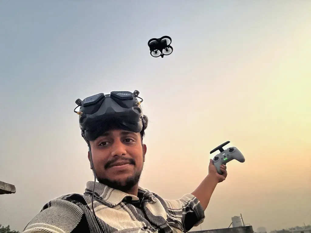 Yash Kansal with FPV goggles and a drone controller